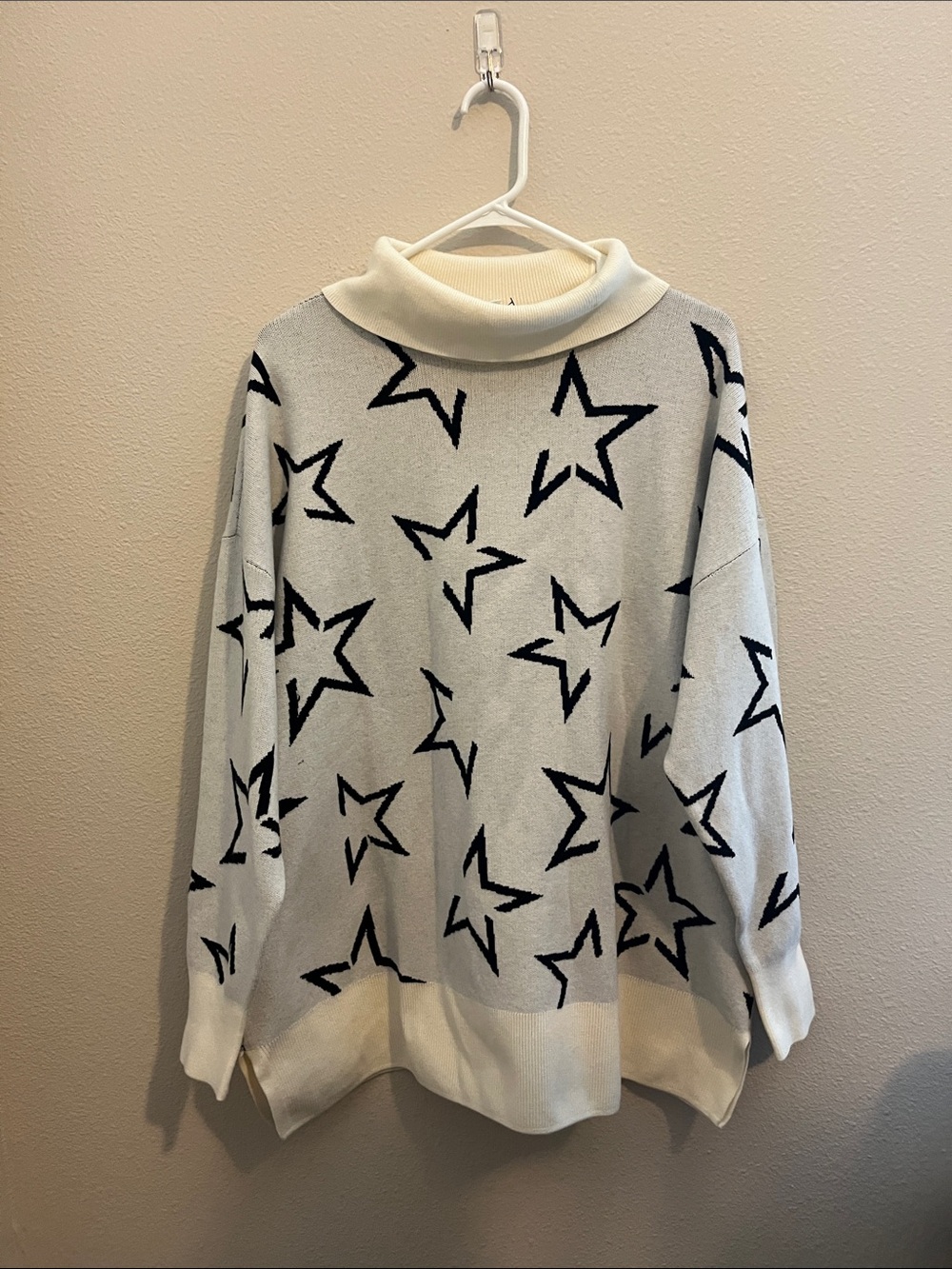 Lane Bryant Livi’s Cream Star-Pattern Turtleneck Sweater